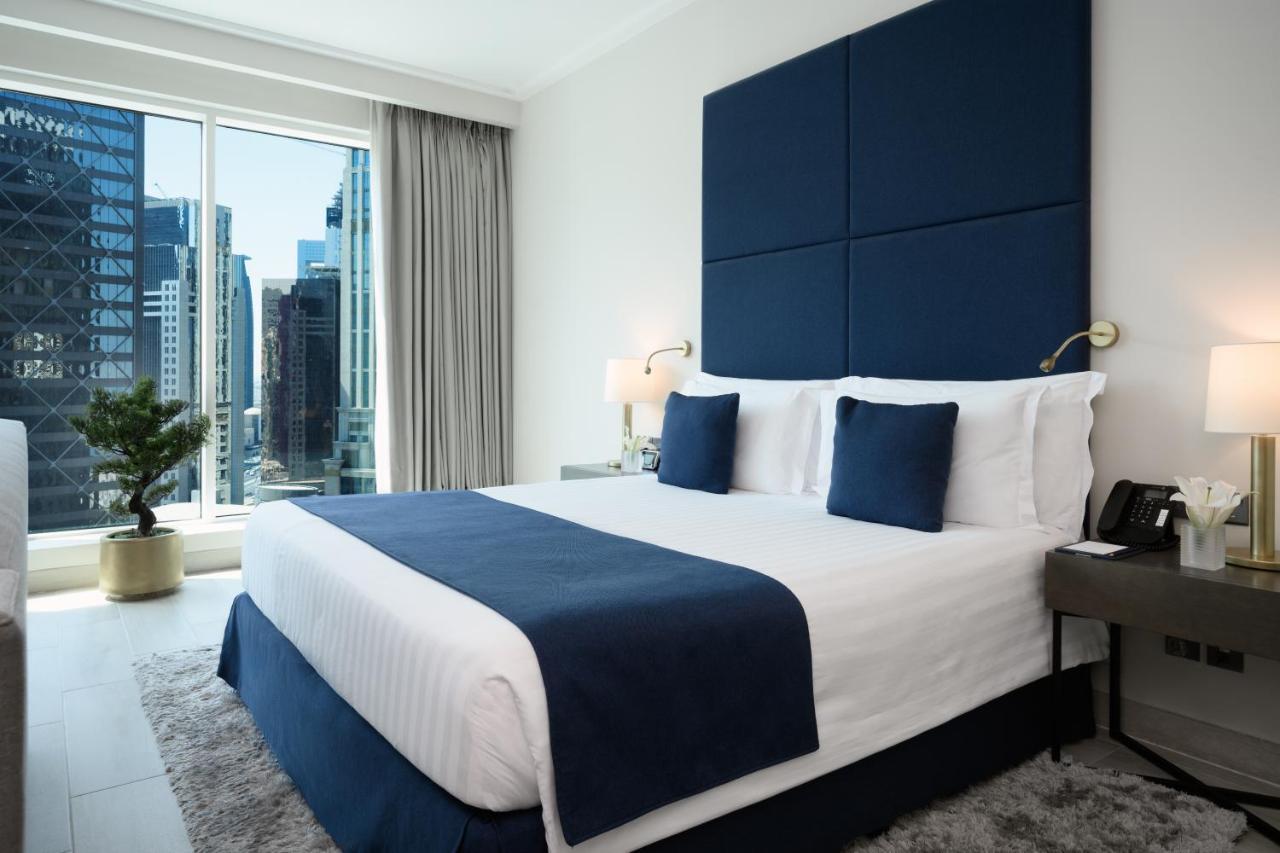 Centara West Bay Hotel & Residences Doha Bagian luar foto A bedroom at the hotel