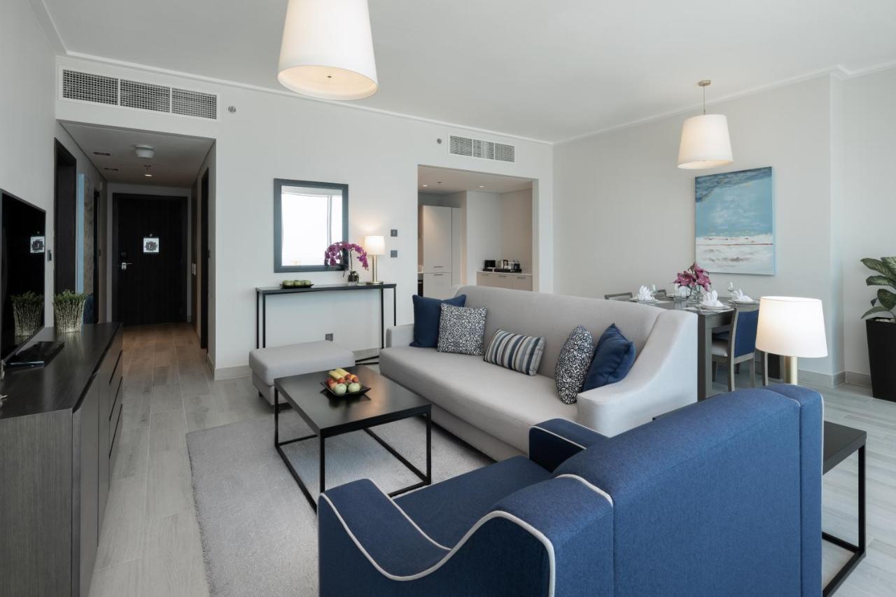 Centara West Bay Hotel & Residences Doha Bagian luar foto A living room at the Address Downtown Hotel
