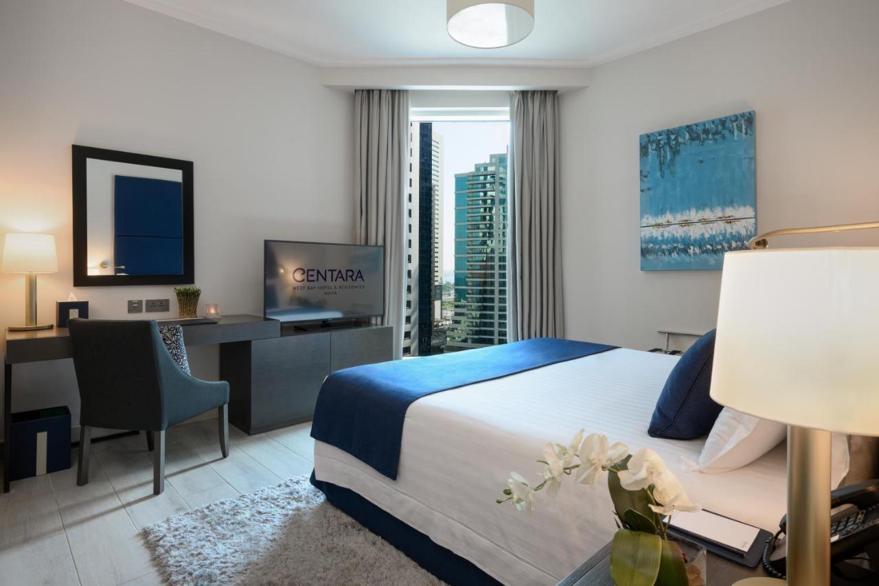 Centara West Bay Hotel & Residences Doha Bagian luar foto A bedroom at the hotel